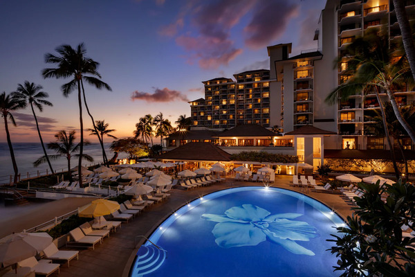 High-rise hotel exterior of Holiday Inn Express Waikiki featuring modern accommodations and convenient access to Waikiki attractions in Hawaii.