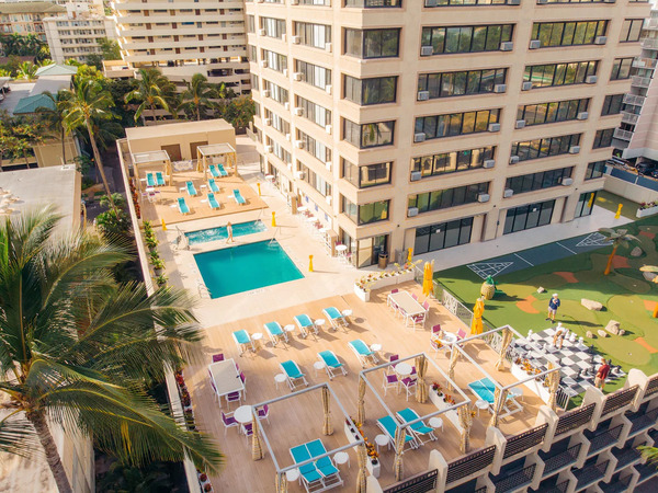High-rise hotel exterior of Holiday Inn Express Waikiki featuring modern accommodations and convenient access to Waikiki attractions in Hawaii.