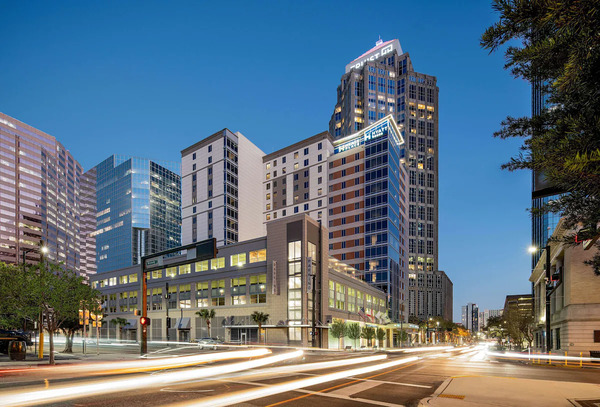 Modern exterior and stylish lobby of Hyatt Place Tampa Downtown featuring contemporary design, comfortable upscale accommodations, bright city views, and a convenient downtown Tampa location.