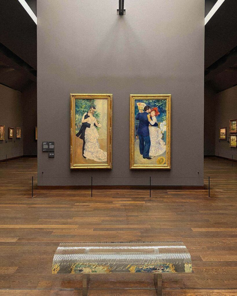 Visitors exploring the Impressionist collection at Musée d'Orsay