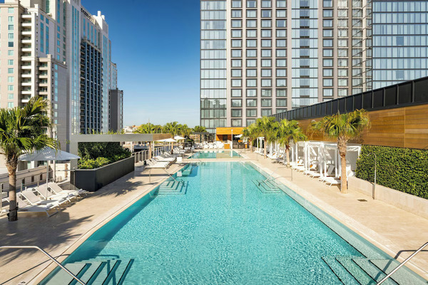 Modern exterior view of JW Marriott Tampa Water Street featuring upscale waterfront luxury, sleek contemporary architecture, premium amenities, and vibrant downtown Tampa city surroundings.