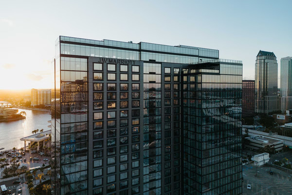 Luxury exterior view of JW Marriott Tampa Water Street featuring its sleek high-rise architecture and upscale downtown waterfront ambiance.
