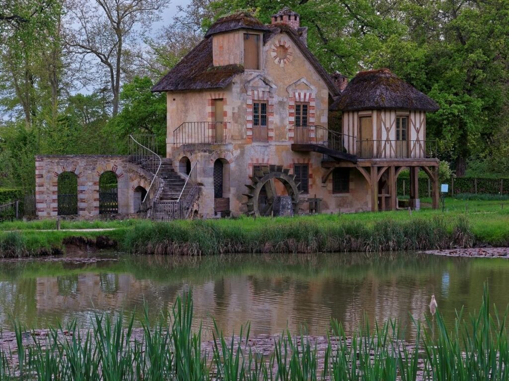Marie Antoinette’s Hamlet at Versailles with small cottages and water features