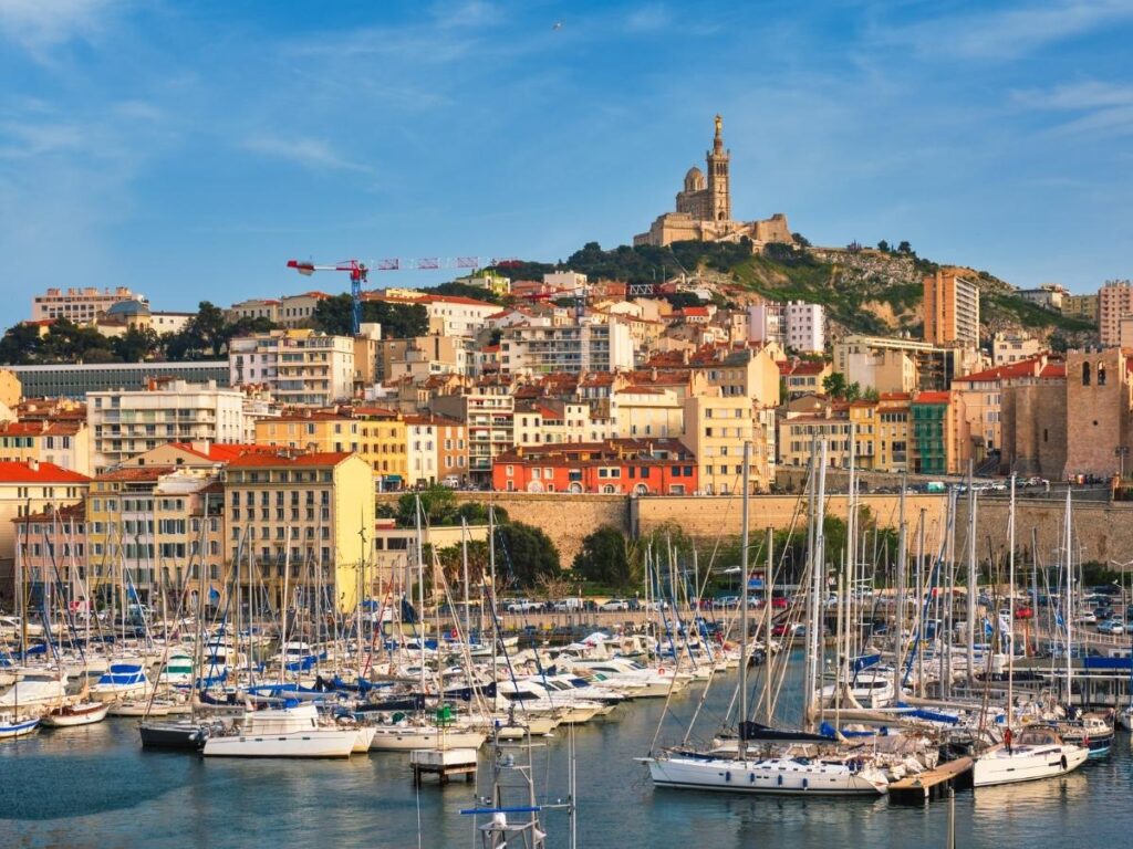 Marseille harbor with Notre Dame de la Garde visible above the city