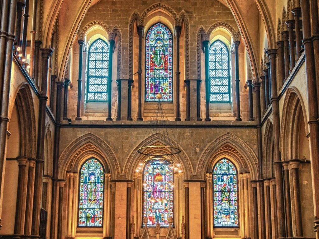 Visitors viewing Marc Chagall windows inside Metz Cathedral