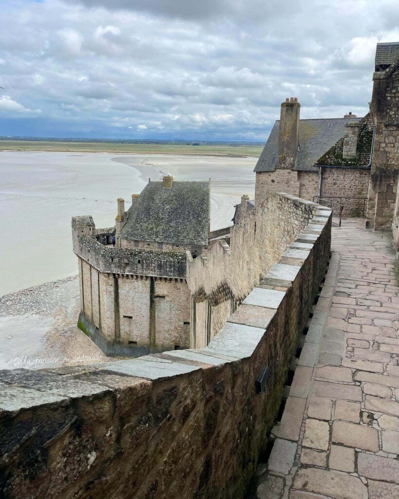 Historic stone corridor inside Mont Saint Michel Abbey