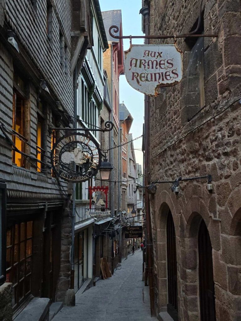 Crowded summer streets inside Mont Saint Michel village