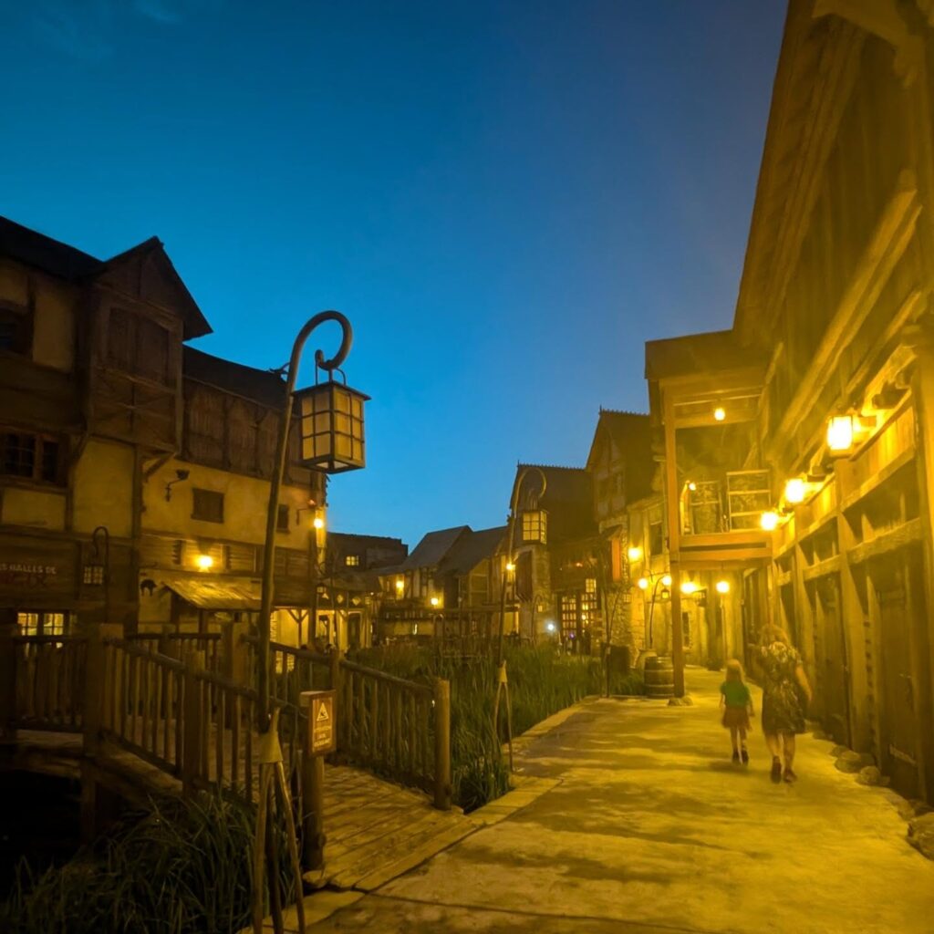 Evening view of Parc Astérix with attractions and lights