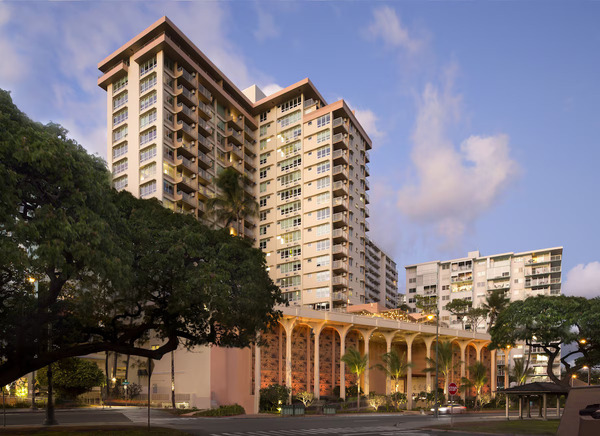 Iconic Waikiki hotel exterior of Queen Kapi'olani Hotel featuring views of Diamond Head and modern tropical accommodations in Hawaii.