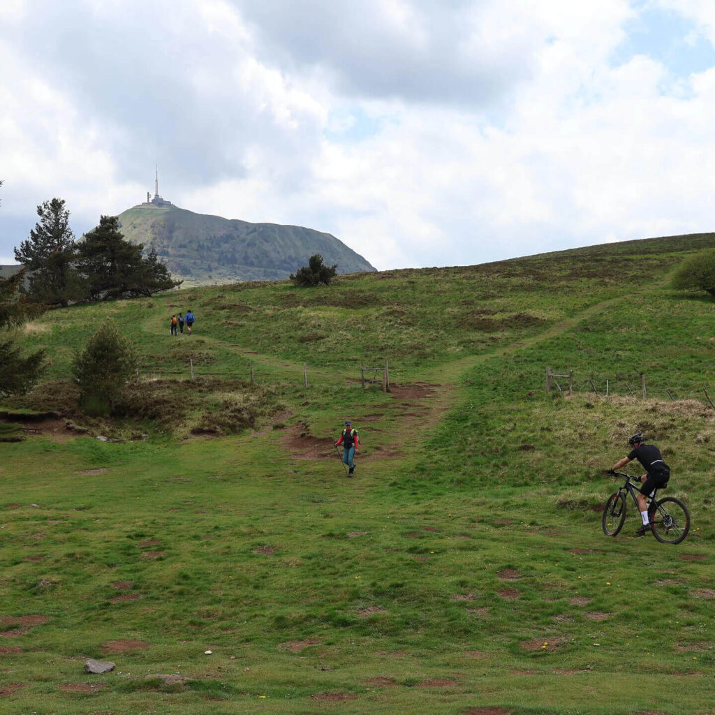 Visitors relaxing near the summit of Puy de Dôme