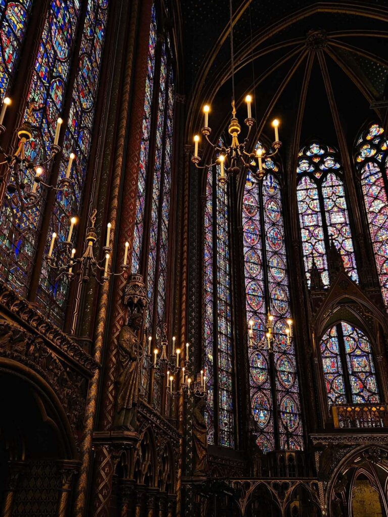 Gothic interior and towering stained glass inside Sainte-Chapelle