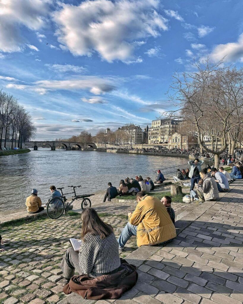 Sunset walk along the Seine River in Paris