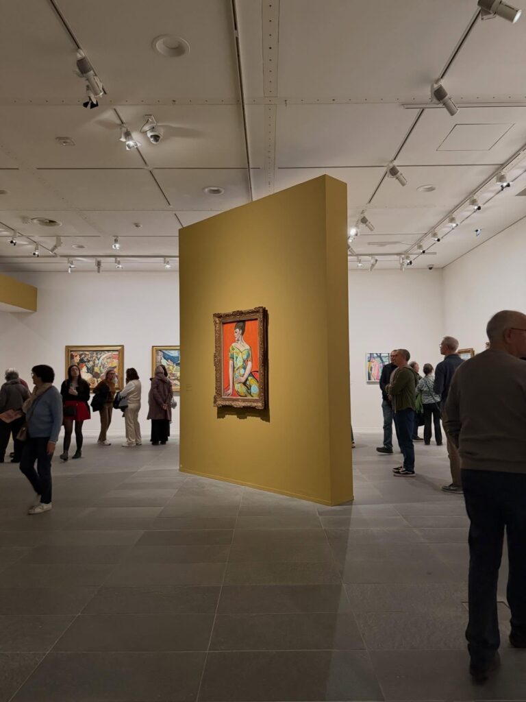 Visitor slowly admiring artwork inside Musée de l'Orangerie