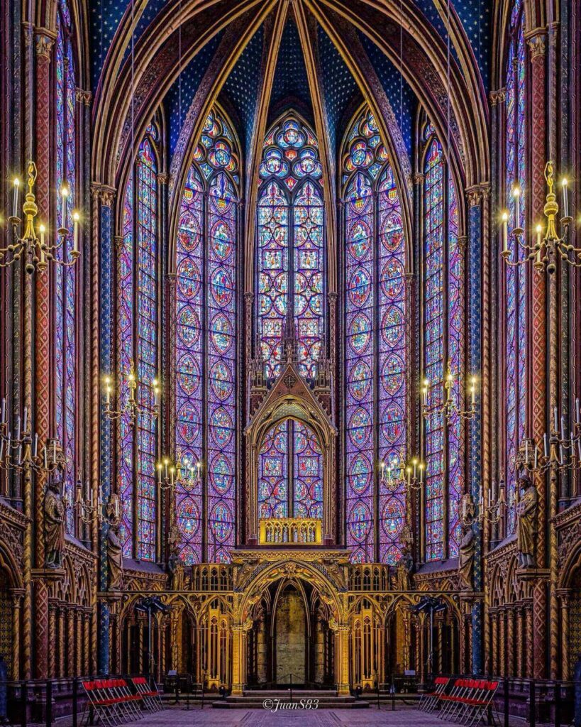 Gothic columns and stained glass inside Sainte-Chapelle