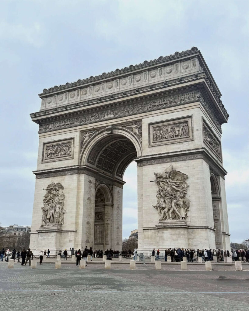 Looking up at the Arc de Triomphe from street level in Paris
