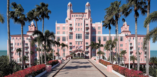 Iconic pink exterior of The Don CeSar beachfront resort featuring grand Mediterranean-style architecture, luxury coastal ambiance, palm-lined beach views, and elegant Gulf Coast scenery.