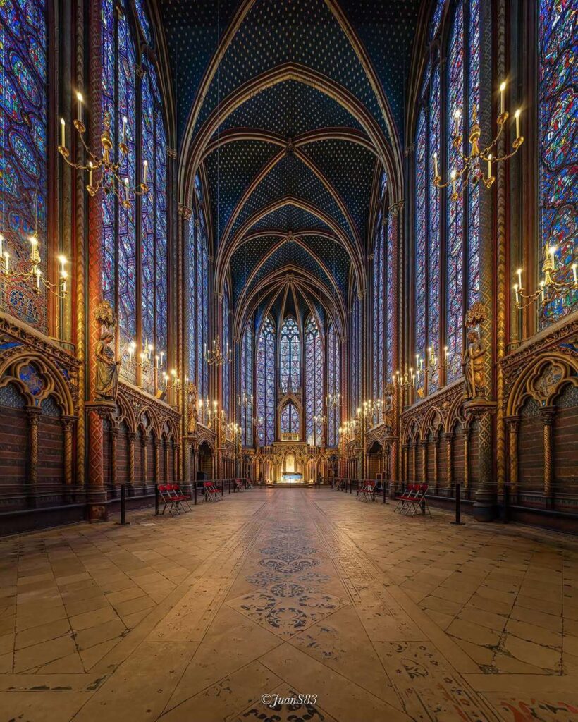 Towering stained glass windows inside Sainte-Chapelle in Paris