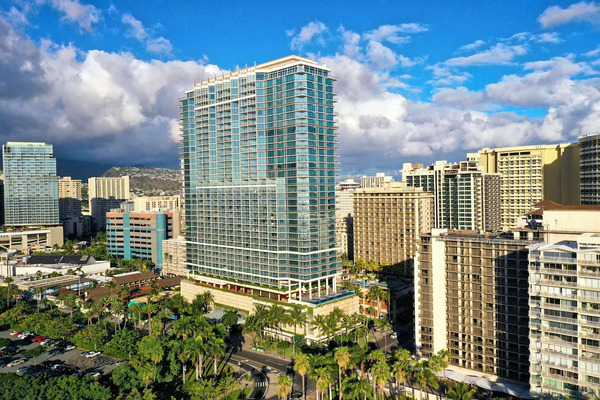 Luxury high-rise exterior of Trump International Hotel Waikiki featuring upscale suites and ocean views near Waikiki Beach in Hawaii.