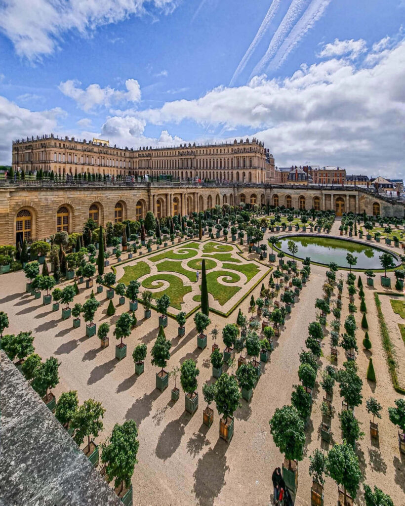 Expansive view of Versailles gardens showing why they are an important part of the visit