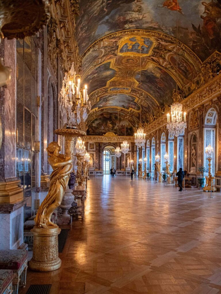 Visitors exploring the Palace of Versailles with a mix of open space and crowds