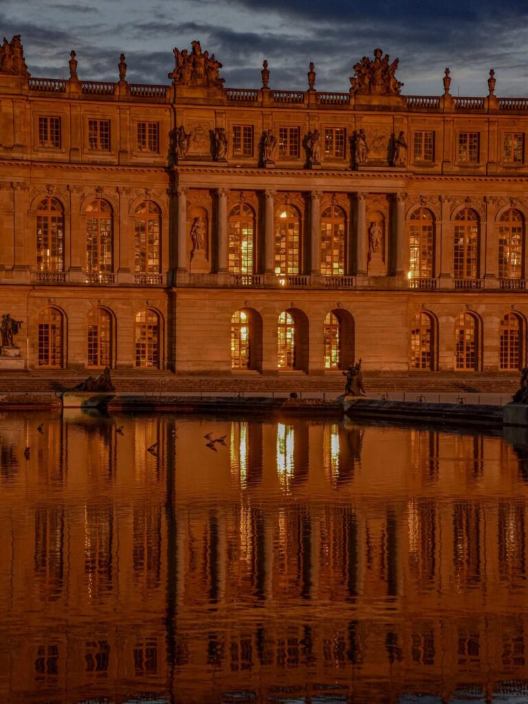 Palace of Versailles during golden hour with warm evening light