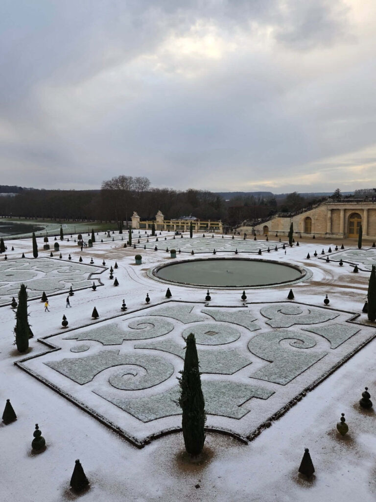 Quiet winter view of the Palace of Versailles courtyard with fewer visitors