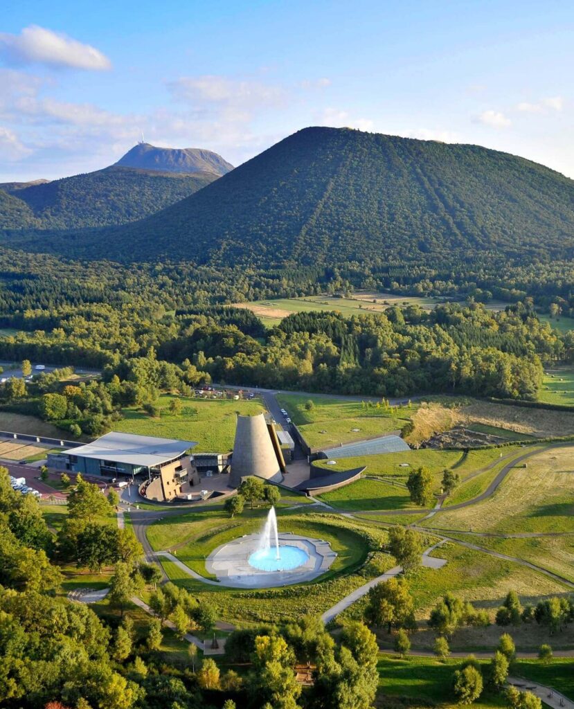 Visitors exploring Vulcania in the volcanic landscapes of Auvergne