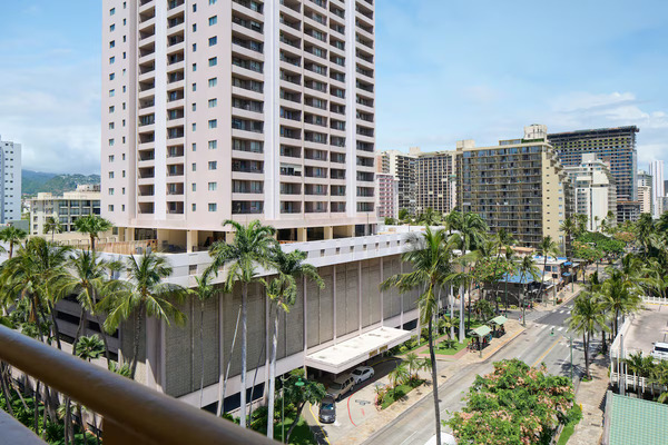 Modern city-style exterior of Waikiki Malia by Outrigger located in Waikiki with comfortable island-inspired accommodations in Hawaii.