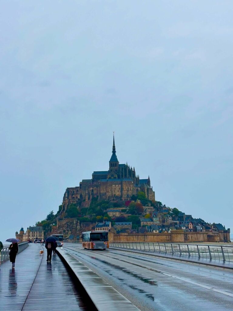 View of Mont Saint-Michel while walking along the causeway