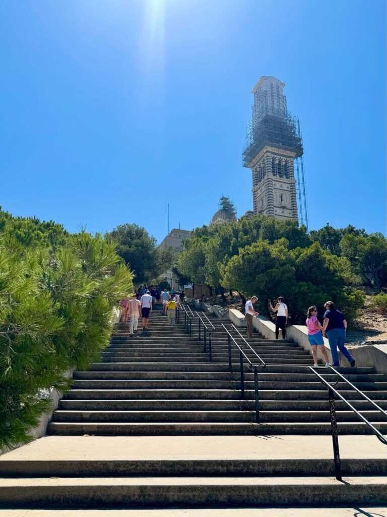 Walking uphill toward Notre Dame de la Garde in Marseille