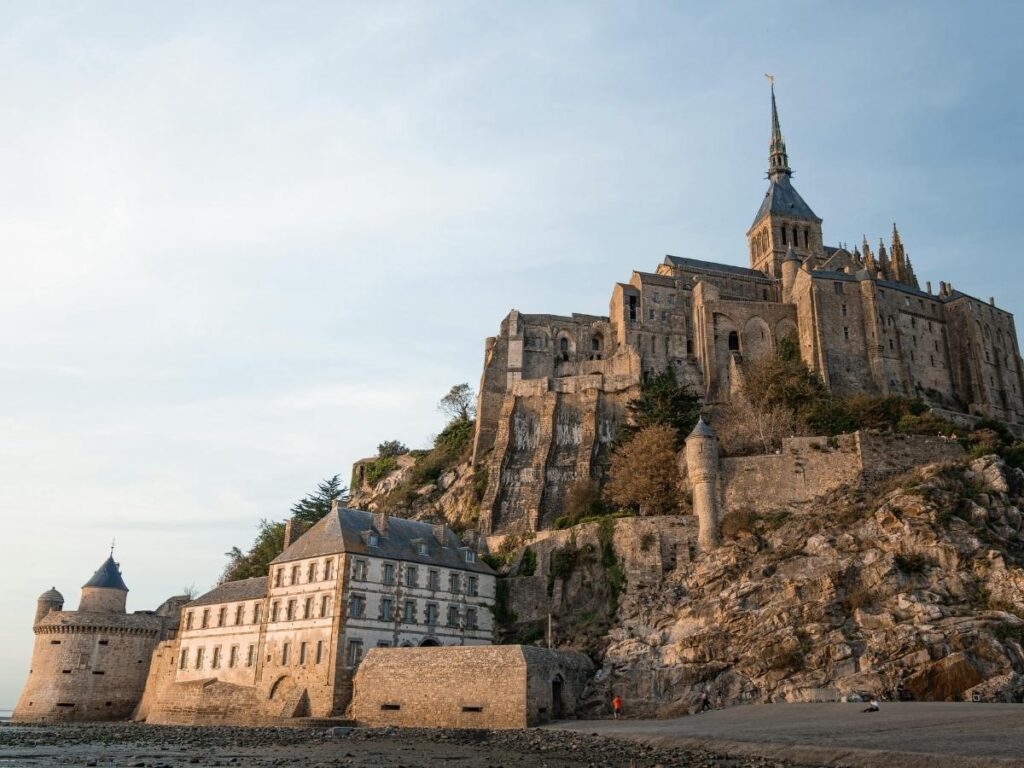 Sunset view of Mont Saint Michel illuminated in Normandy France