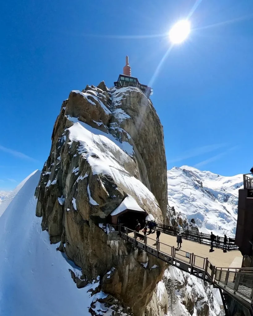 Visitors exploring the Aiguille du Midi summit at 3,842 meters above sea level