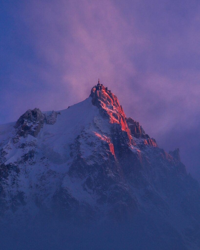 Mont Blanc and surrounding peaks seen from Aiguille du Midi in golden evening light
