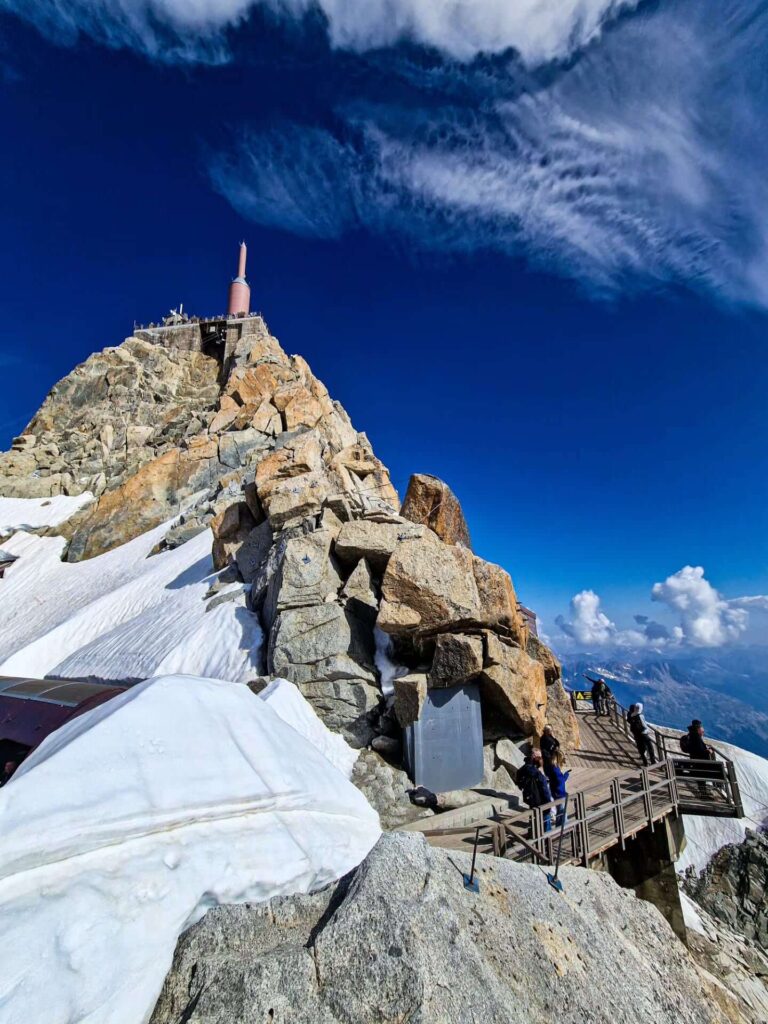 Visitors enjoying mountain views from the Aiguille du Midi viewing terraces
