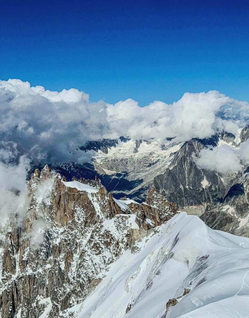 Snow-covered peaks surrounding Aiguille du Midi during winter
