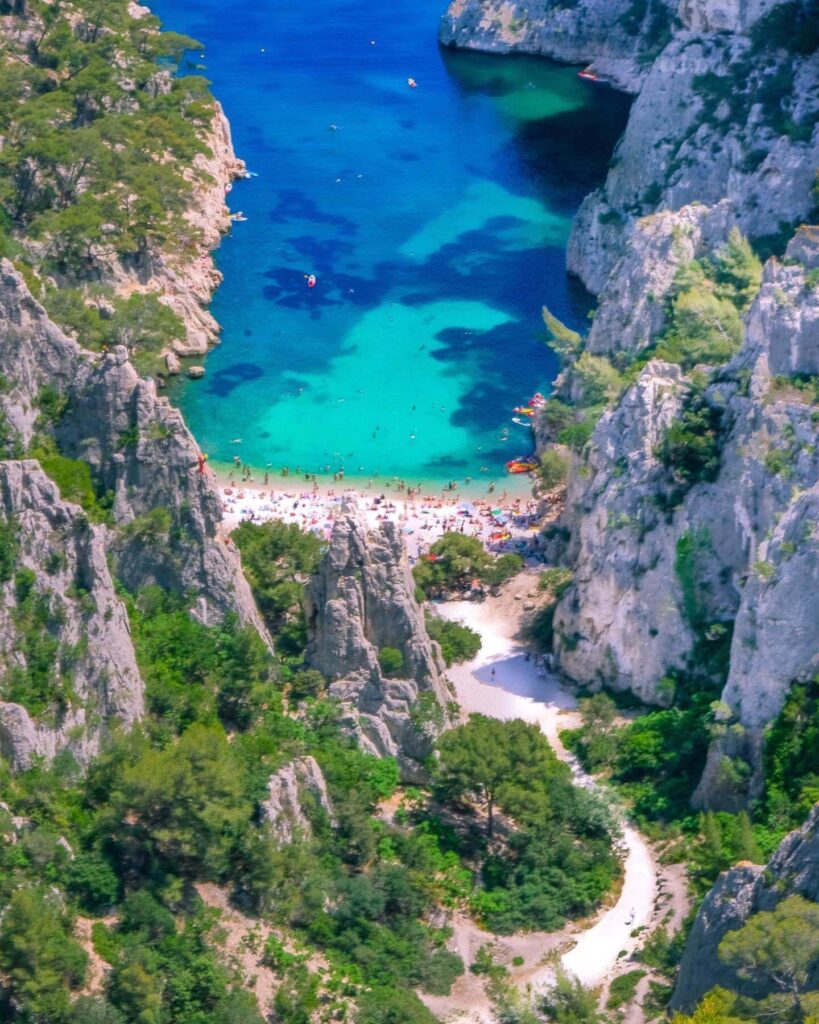 Calanque d'En-Vau surrounded by limestone cliffs and turquoise water