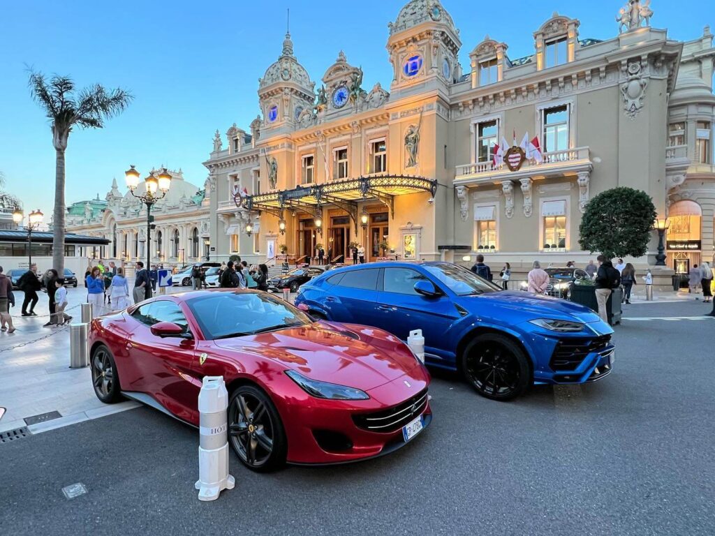 Visitors and luxury cars in Casino Square outside Monte Carlo Casino