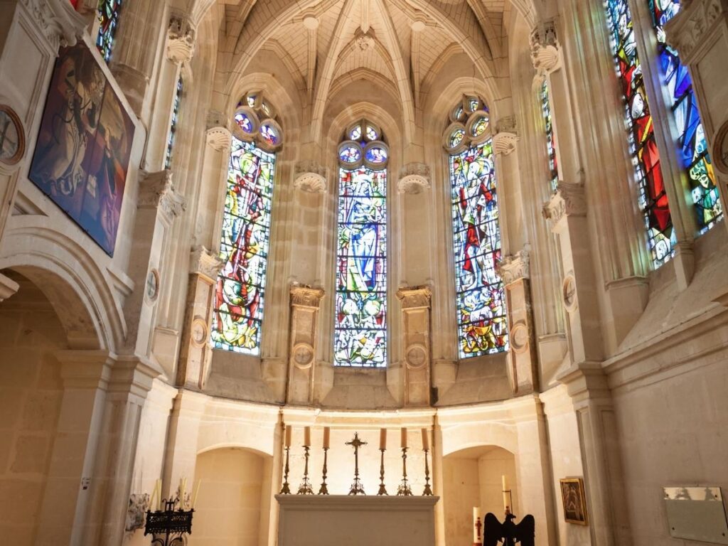 Historic chapel inside Château de Chenonceau with stained glass windows