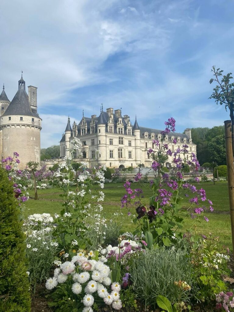 Front view of Château de Chenonceau surrounded by formal Renaissance gardens