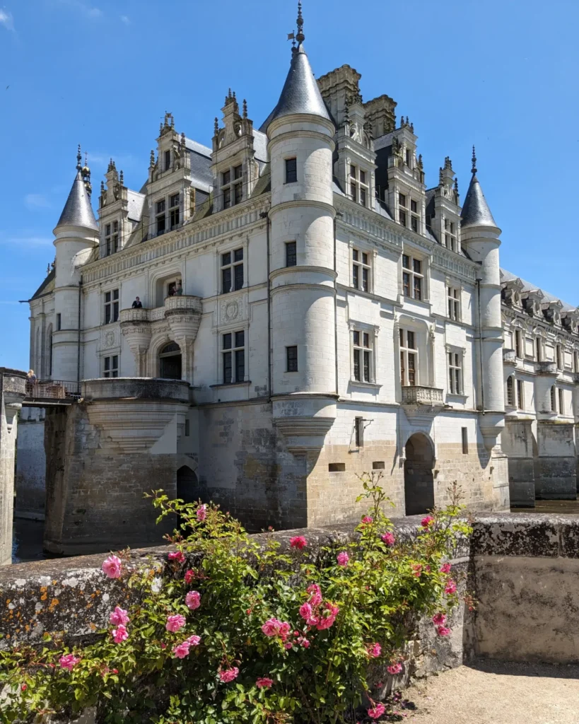 Front view of Château de Chenonceau surrounded by formal gardens
