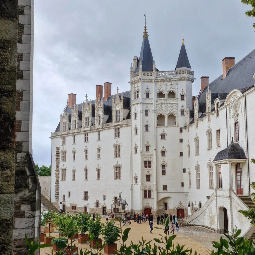 Château des ducs de Bretagne in Nantes with medieval walls, towers, and surrounding moat