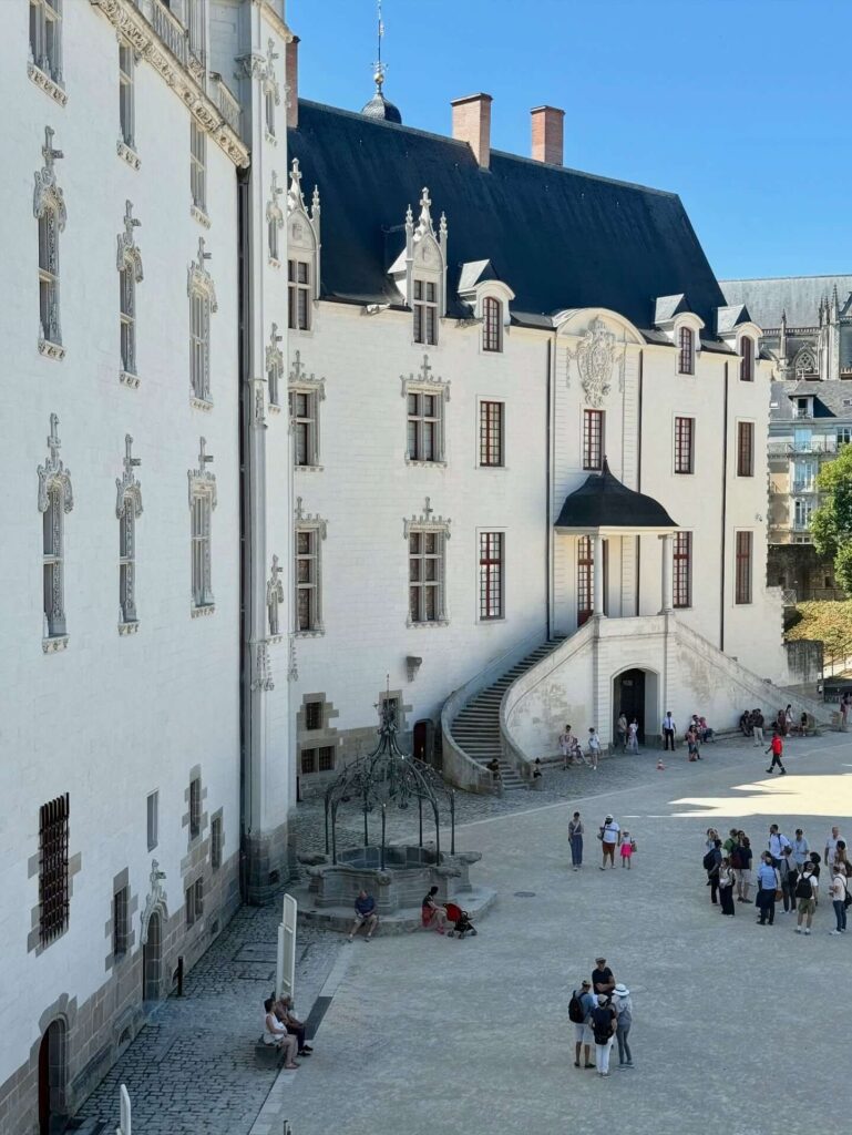 Renaissance courtyard inside Château des ducs de Bretagne with white stone buildings