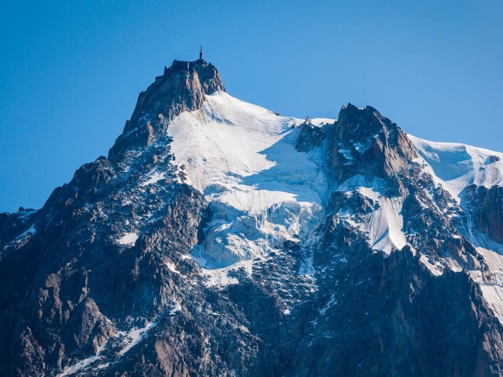Clear views of Mont Blanc and surrounding peaks from Aiguille du Midi on a sunny day