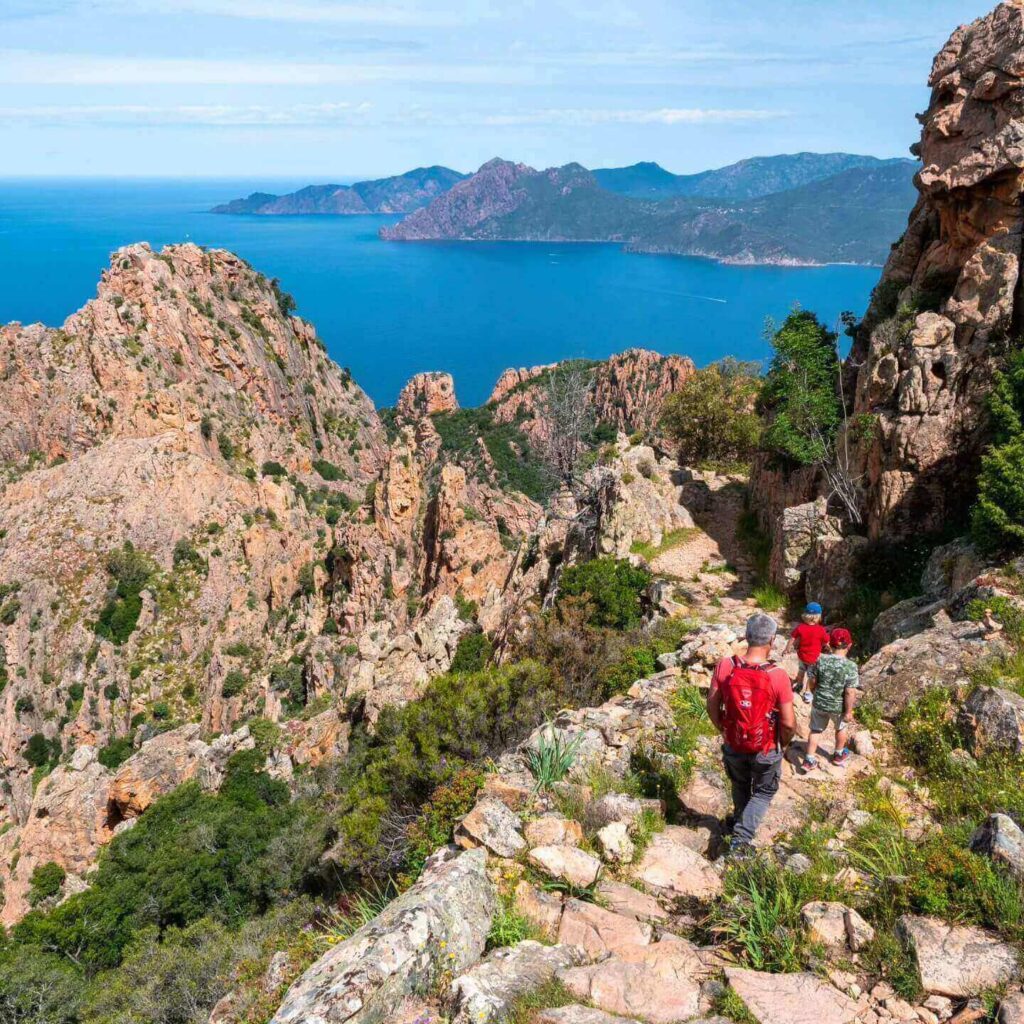 Hiking and sightseeing in the Calanques de Piana during a full-day visit