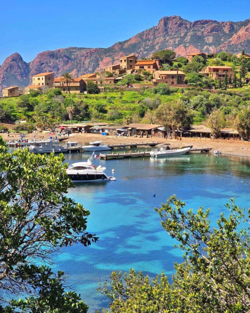Remote seaside village of Girolata surrounded by hills on Corsica's west coast