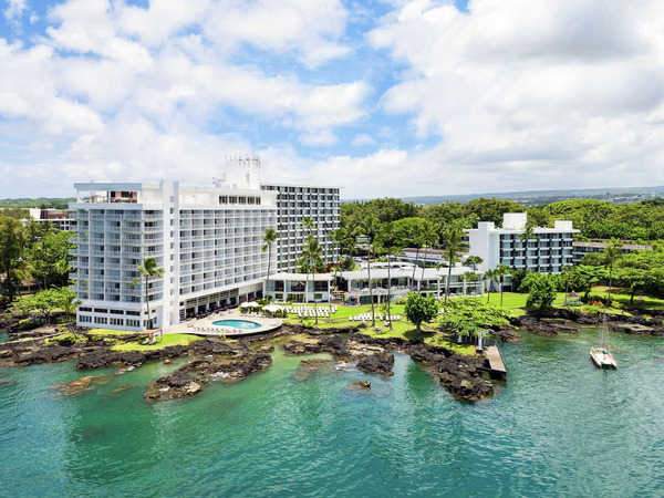 Beautiful oceanfront setting at Grand Naniloa Hotel Hilo on Hawaii's Big Island, featuring modern accommodations, panoramic Pacific Ocean views, lush tropical surroundings, and a relaxing island atmosphere.