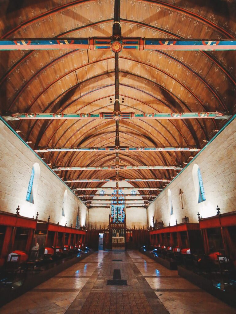 Wooden vaulted ceiling inside the Great Hall of the Poor at Hospices de Beaune