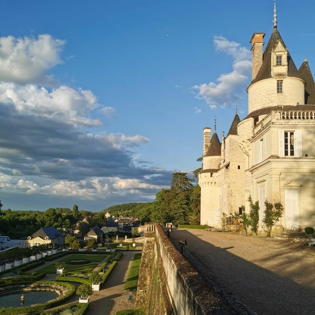 Formal gardens at Château d'Ussé with views of the castle towers