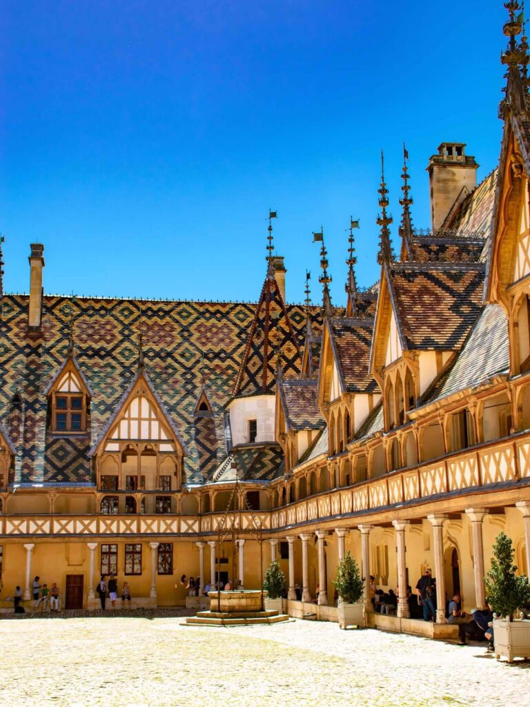 Colorful glazed tile roof of Hospices de Beaune in Burgundy, France