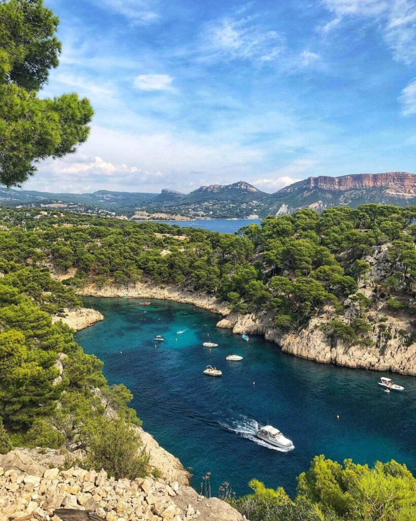 Kayakers exploring turquoise waters in Calanques National Park